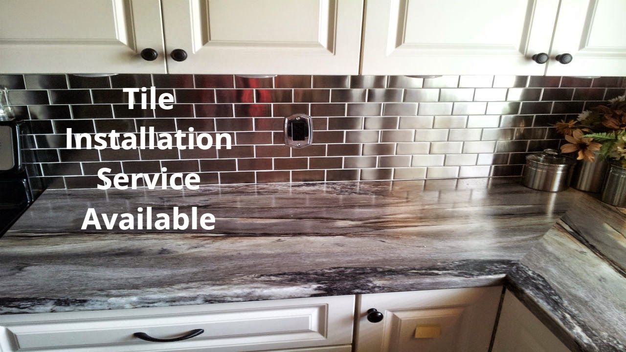 Custom contertop contractor services installing a new countertop and wall tile. 