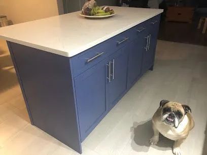 Blue kitchen island cabinet painting project in Halifax with quartz countertop and modern hardware