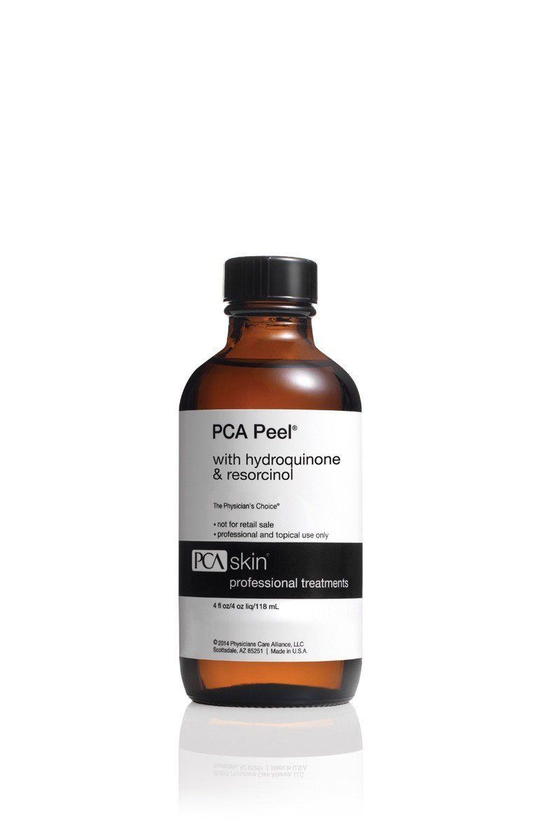 A bottle of fca peel is sitting on a white surface.
