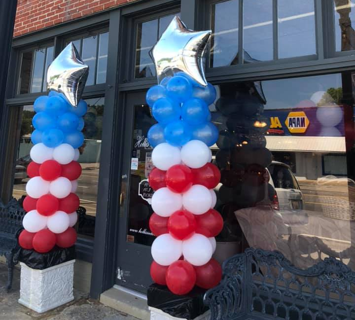 A business in Foley, AL shows a balloon design with columns flanking the front door for an event