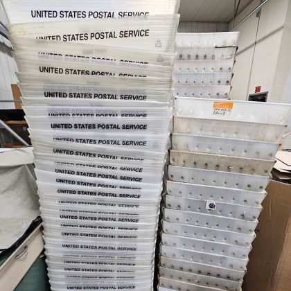 Stacks of united states postal service containers