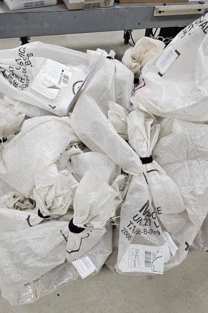 Pile of white shipping bags