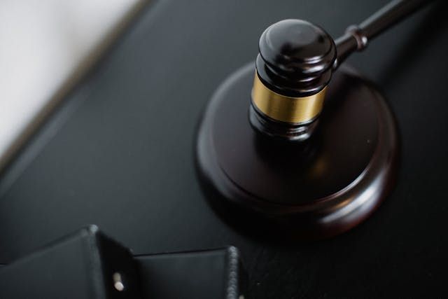 a+gavel+on+a+wood+plate