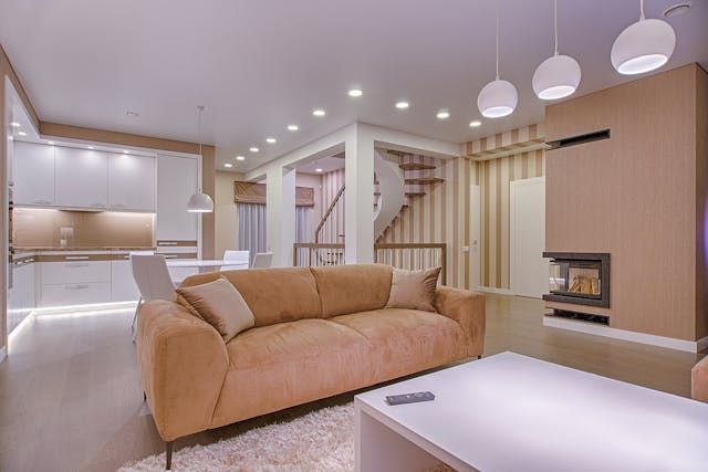 beige-couch-and-walls-with-white-accents-and-cupboards