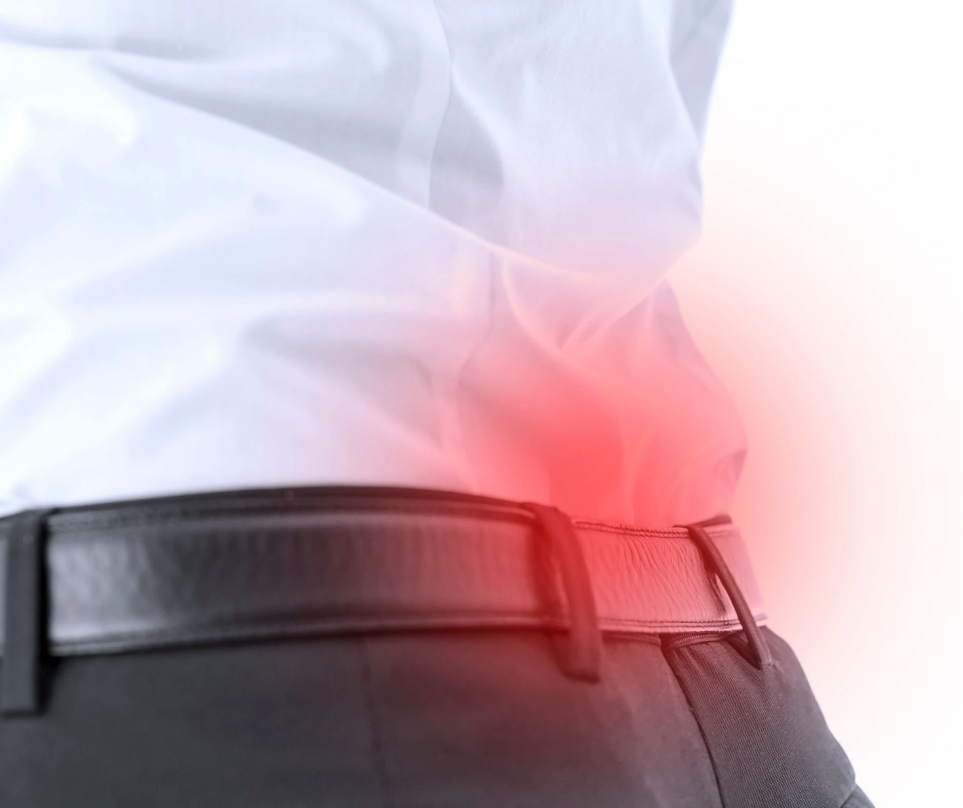Person in white shirt and black pants, with a red highlighted area around lower back.