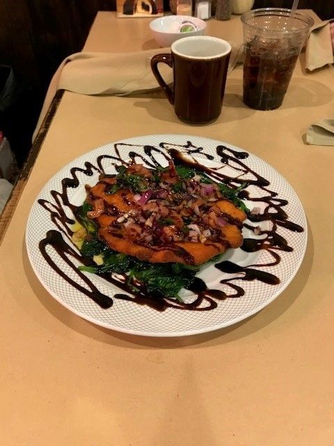 A plate of chicken bruchetta on a table