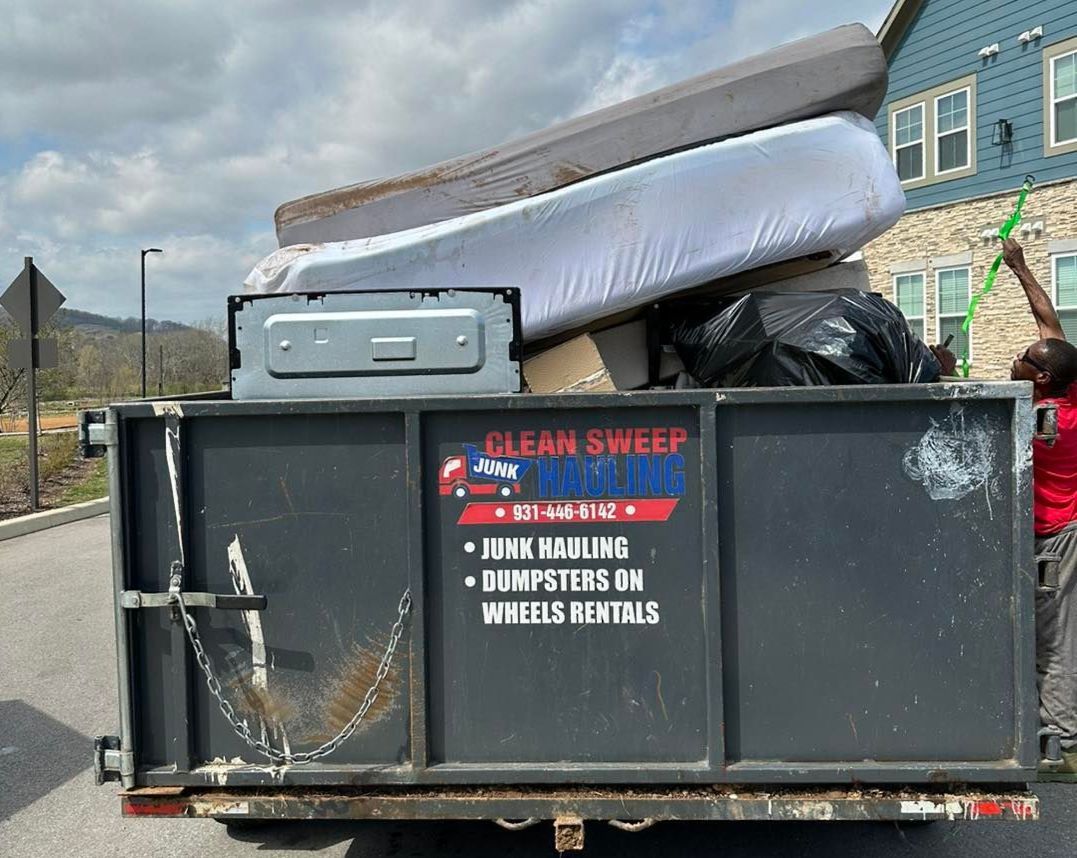 hauling away junk in branded trailer