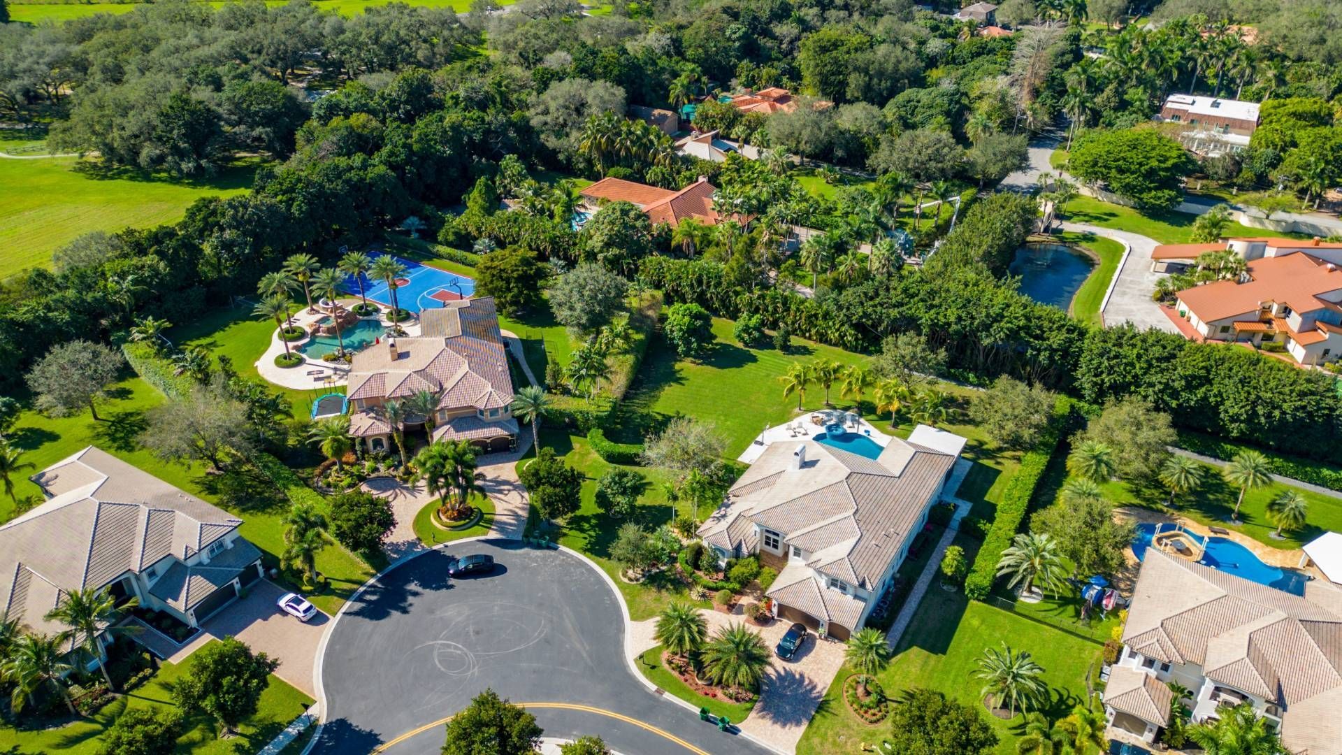 An aerial view of a residential area with lots of houses and trees.