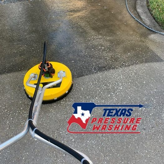 A texas pressure washing logo is on a concrete surface
