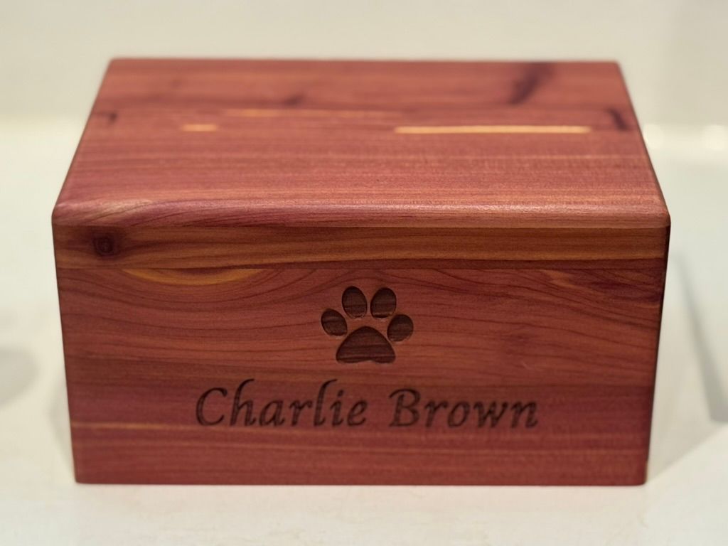 Wooden pet urn with paw print and engraved name 