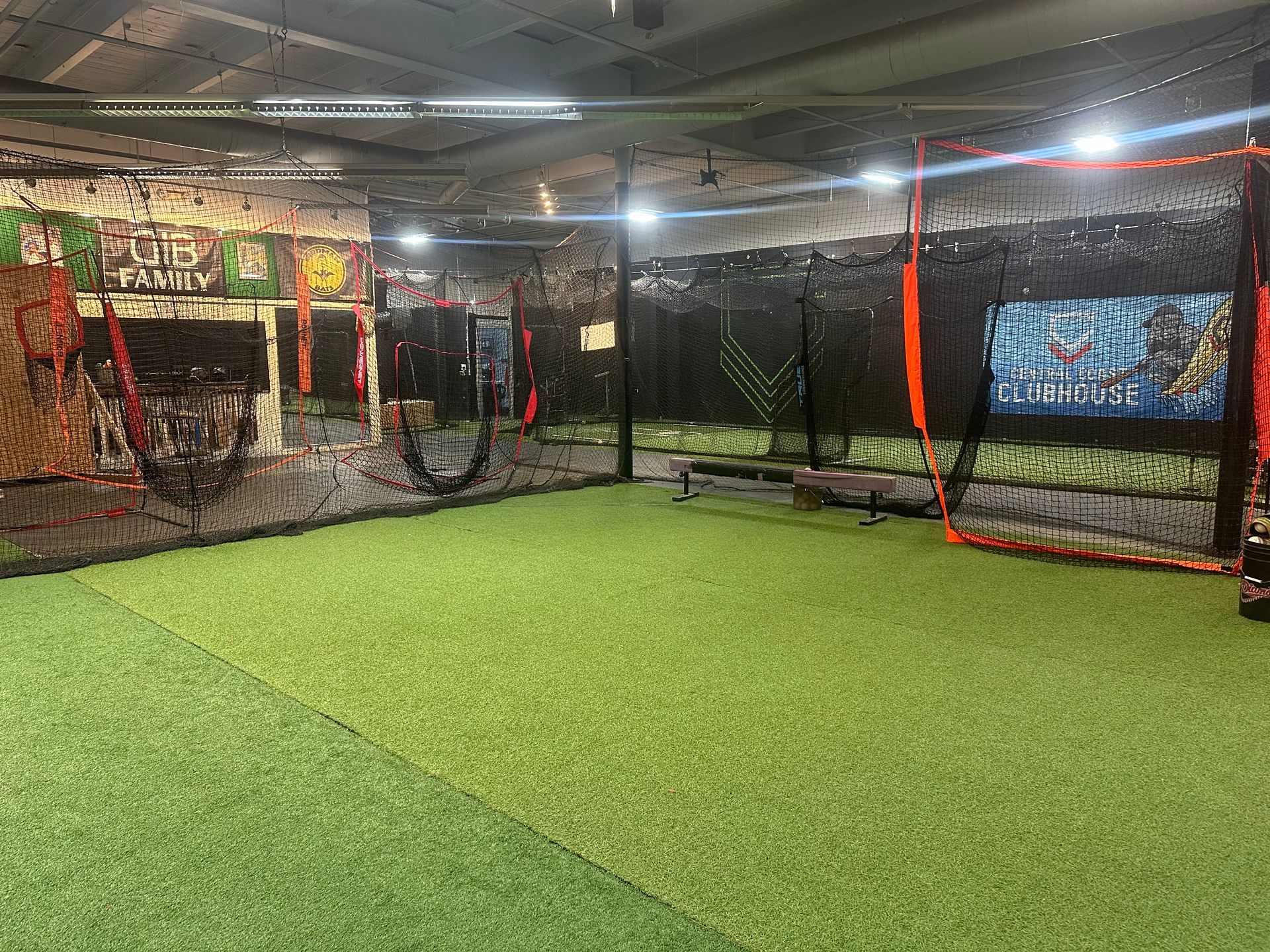 A large batting cage with a lot of nets.