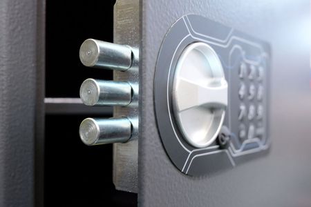 A close up of a safe with a digital lock.