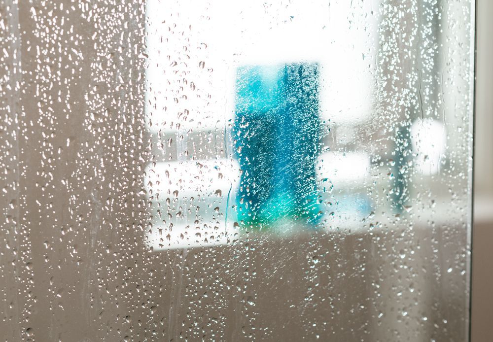 Close-up of a Steamy Shower Door With Water Droplets — Southside Glass & Aluminium in Gordonvale, QLD