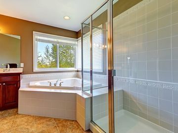 A Bathroom With A Tub And A Walk In Shower — Southside Glass & Aluminium In Bentley Park, QLD 