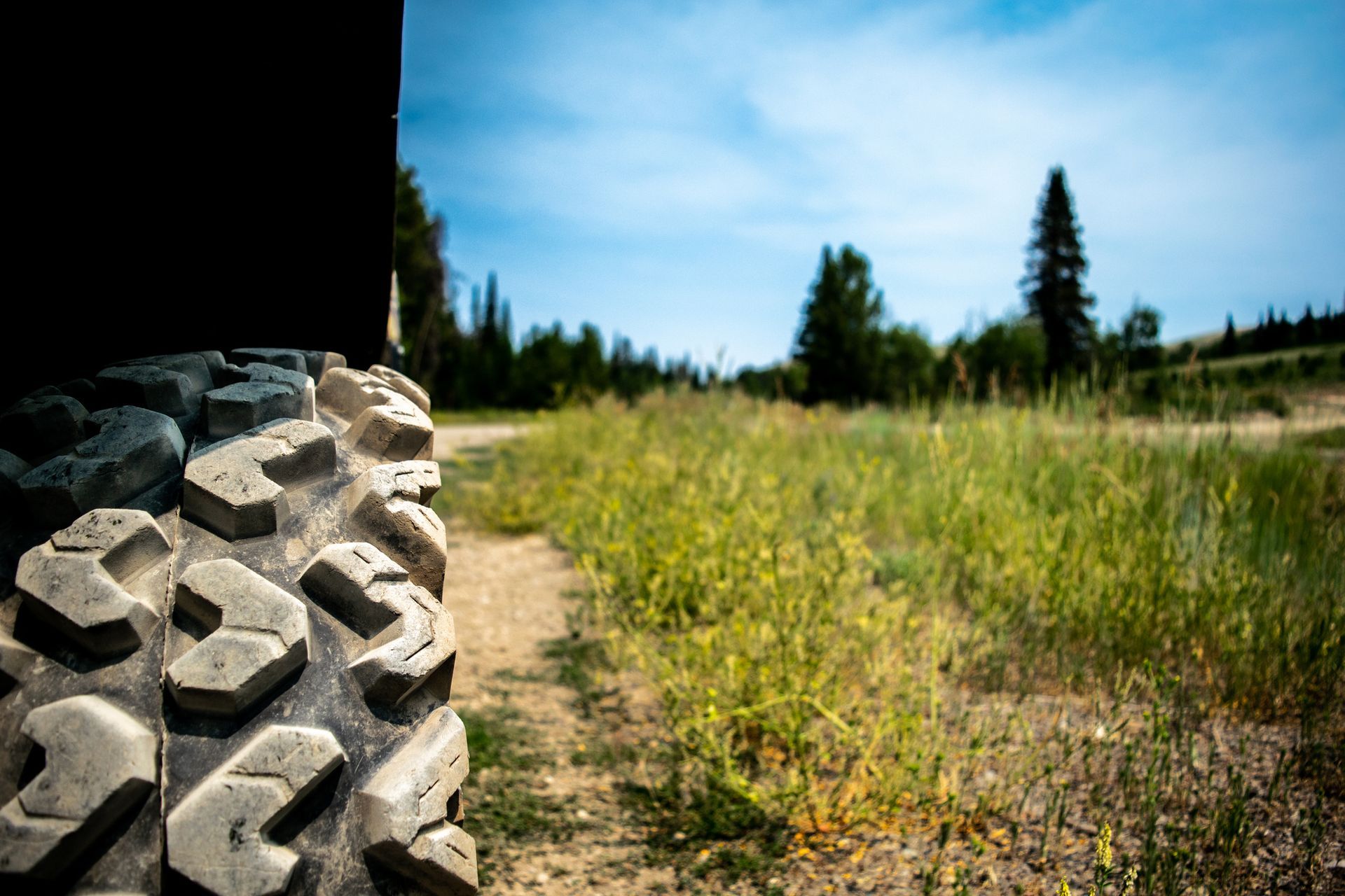 A tractor is planting seeds in a field