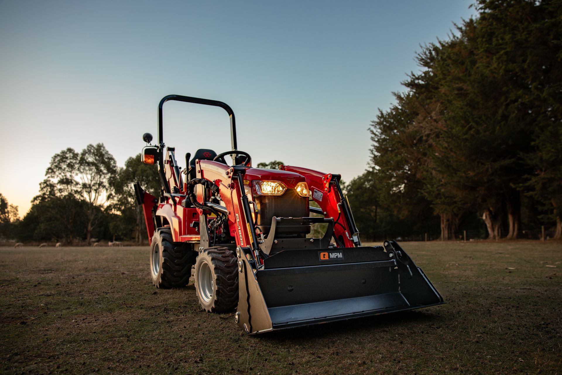 Farm tractors in use, representing modern farming equipment in scenic rural landscape view.
