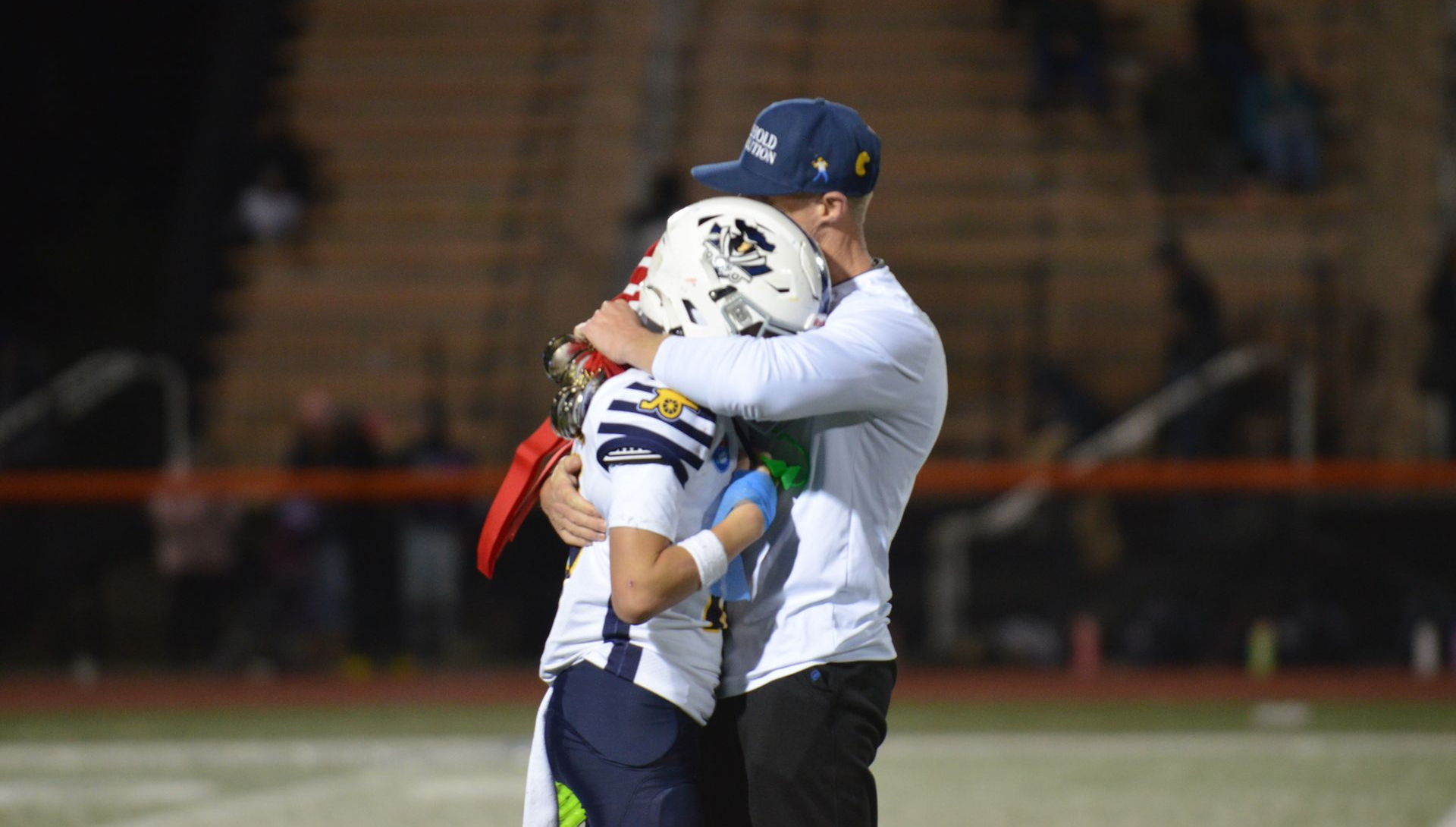 Coach supports player who is injured.