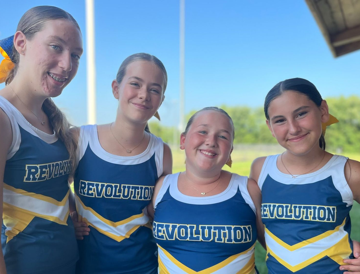 Cheerleader crew smiling for the camera