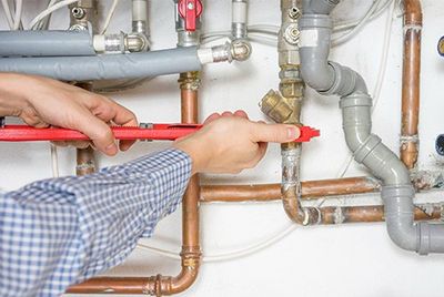 Electric Water Heater — Plumber Fixing Central Heating System in Goldsboro, NC