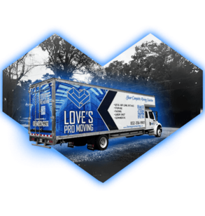 Love's Pro Moving truck with blue heart logo, on a road with trees in background.