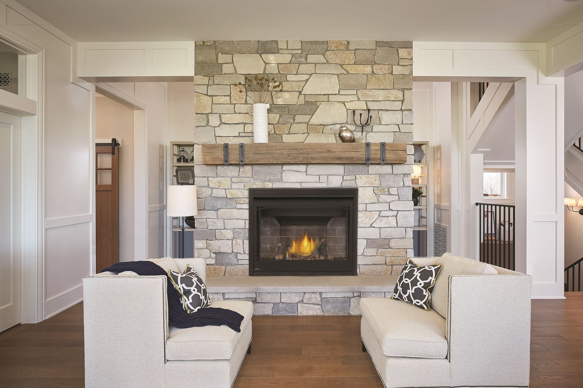 A living room with a fireplace and a tv stand