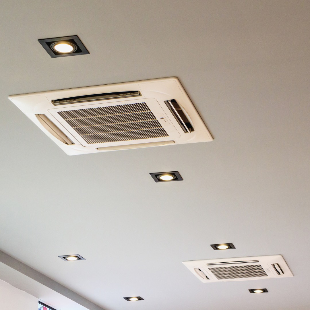 A ceiling with a fan and lights on it