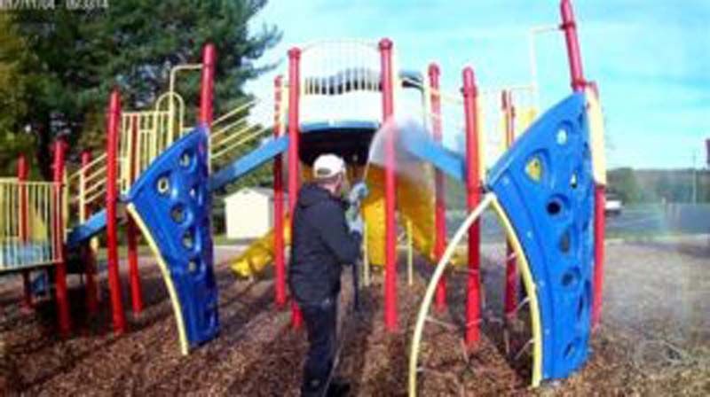 man washing playground