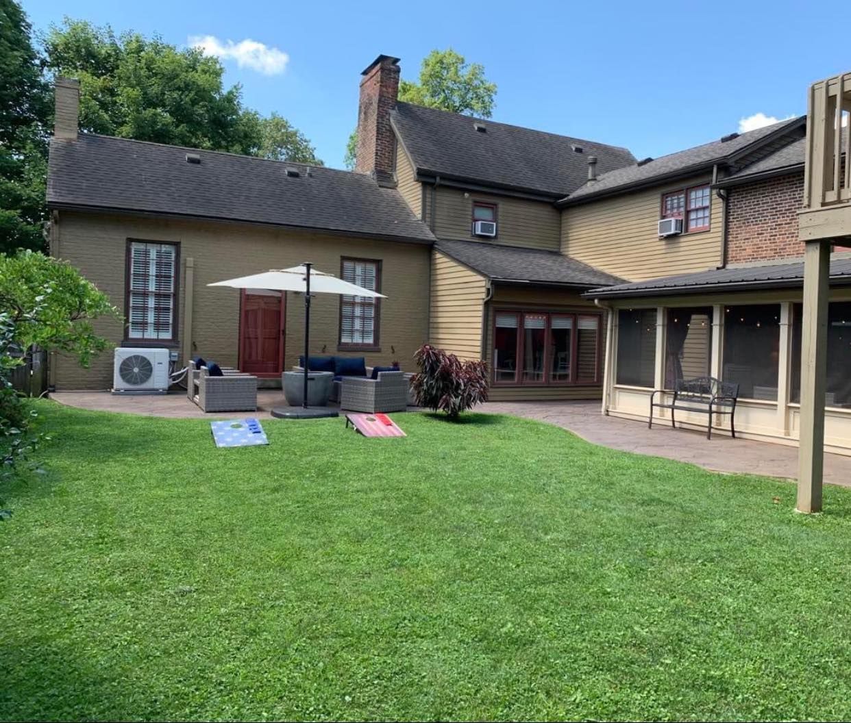 A large house with a large lawn in front of it