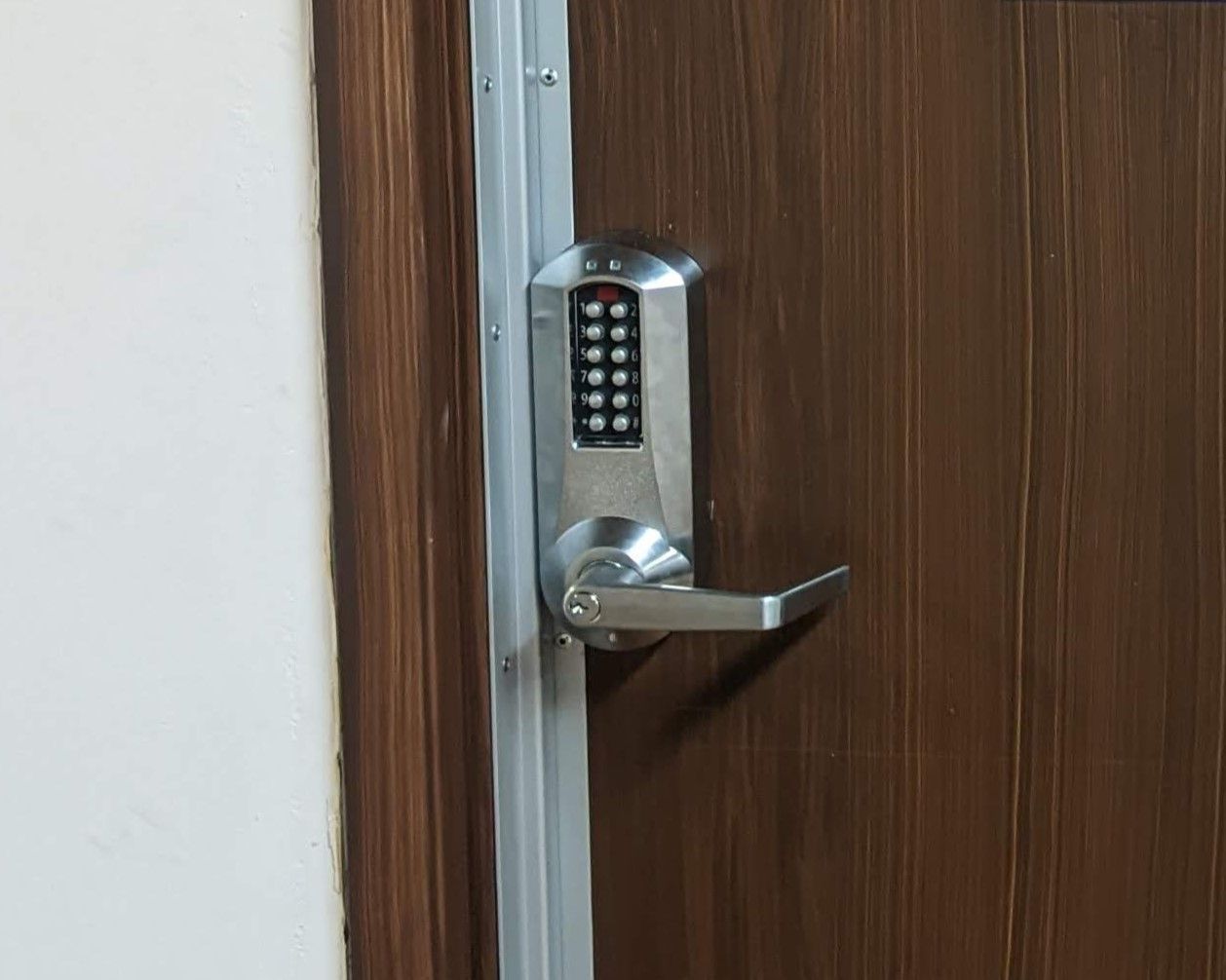 a close up of a door with a digital lock on it