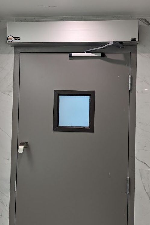 a door with an automatic operator