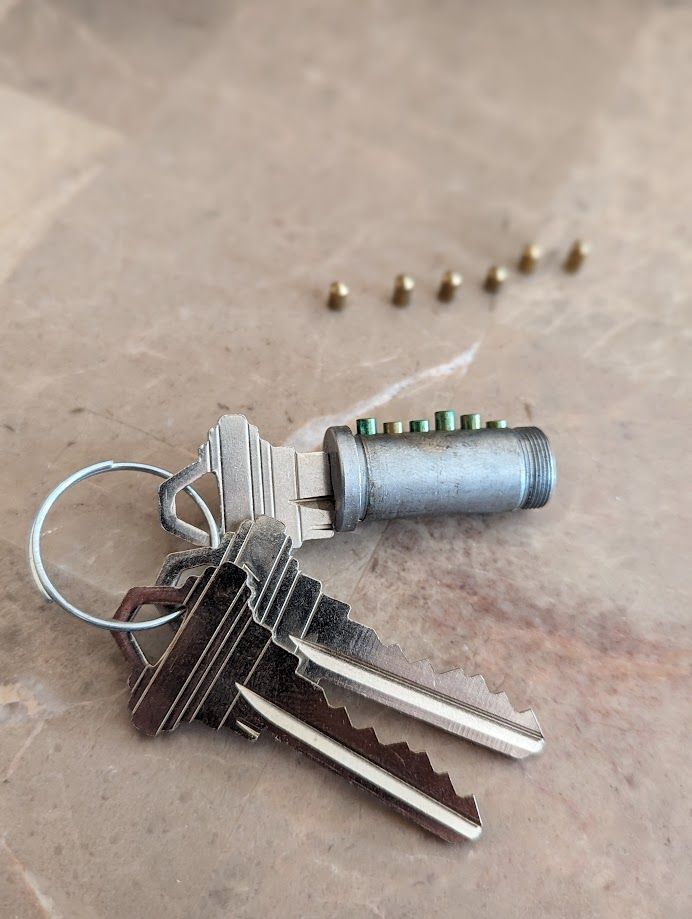 a man is fixing a door lock