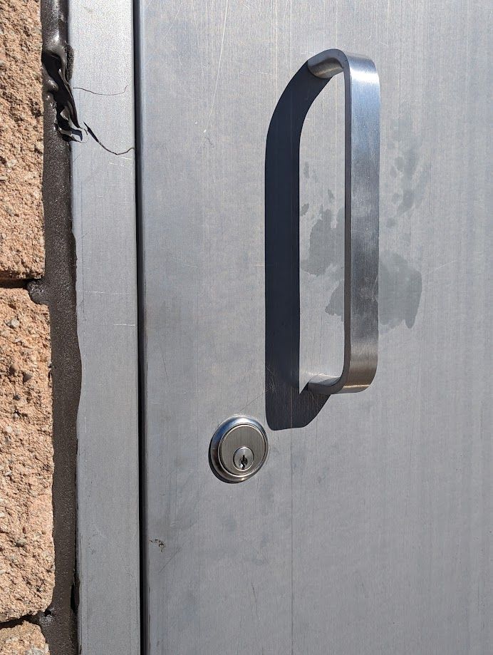 A close up of a door with a handle on it