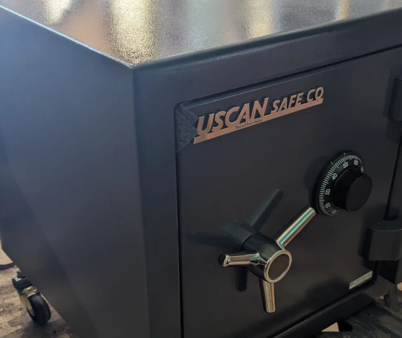 A tuscan safe co safe with a combination lock