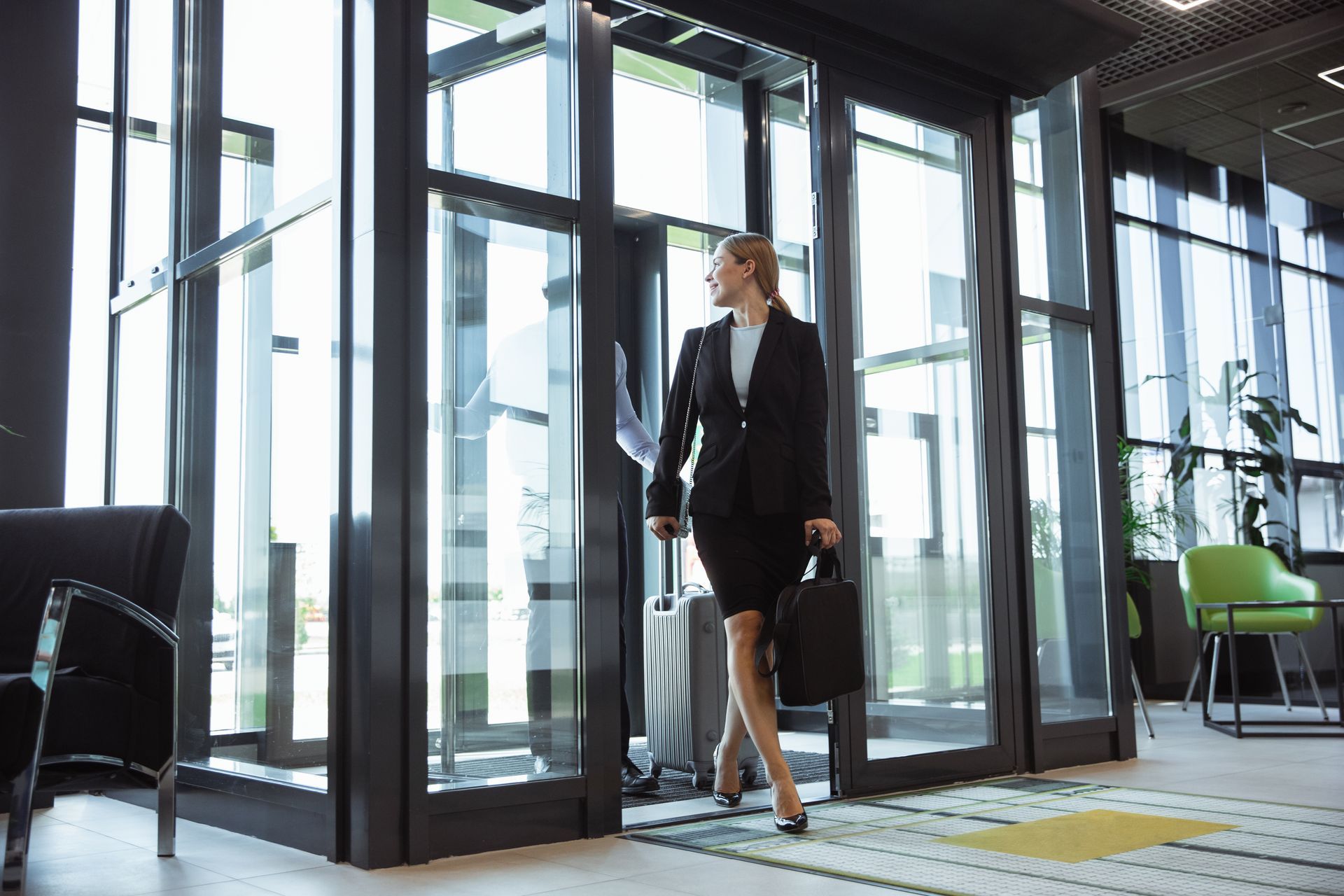 woman entering an office with glass doors