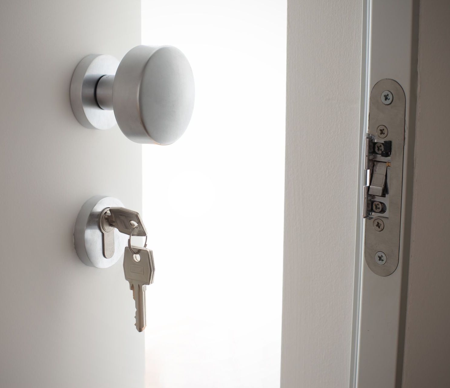 a close up of a door with a key in it