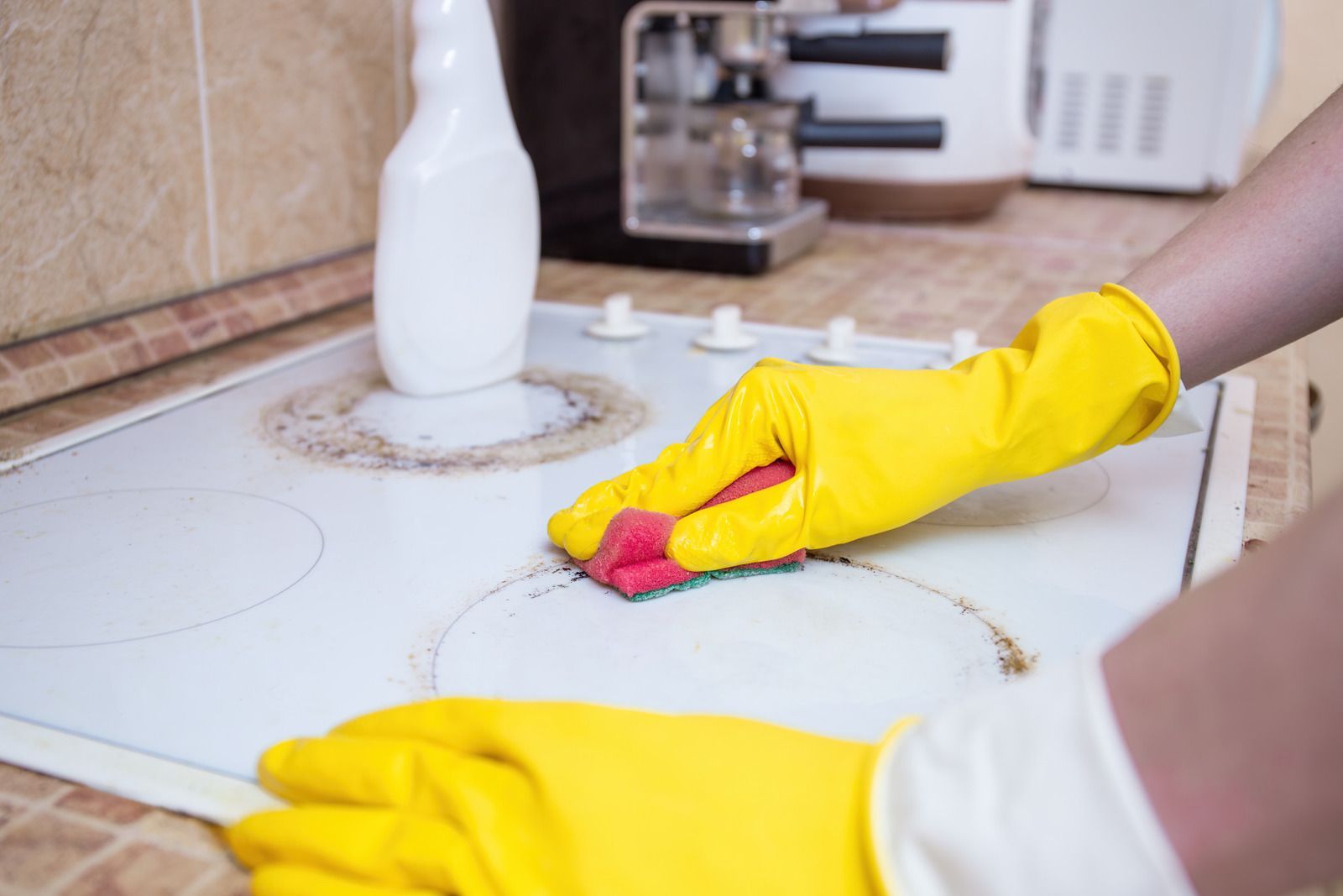 Two men are standing in an empty room with black walls