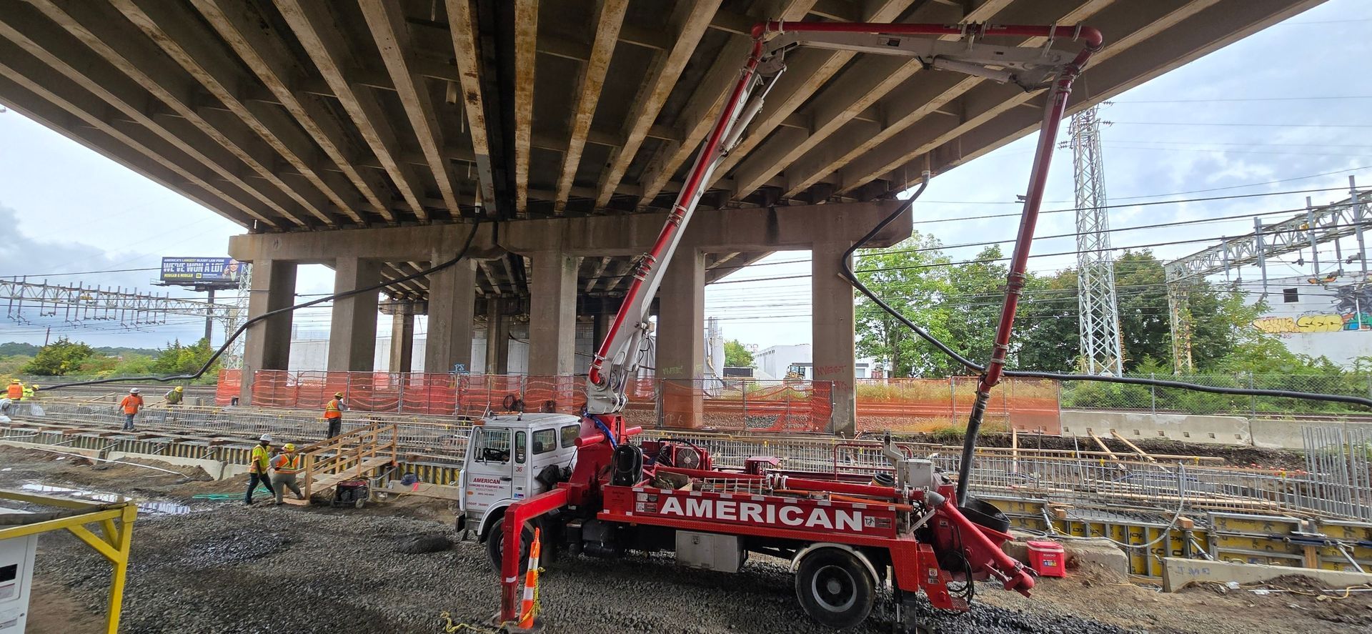 A Concrete Bridge Is Being Built Over a Gravel Road - Middletown, CT - American Concrete Pumping