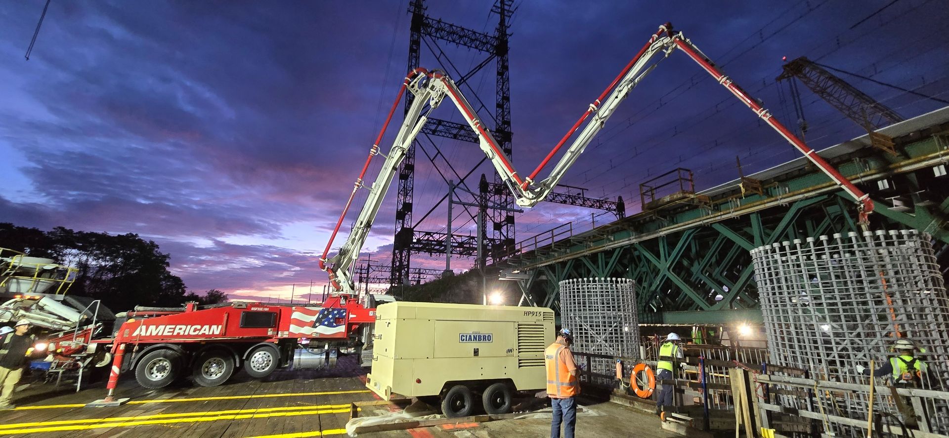 A Bridge Is Being Built Over a River with A Crane - Middletown, CT - American Concrete Pumping
