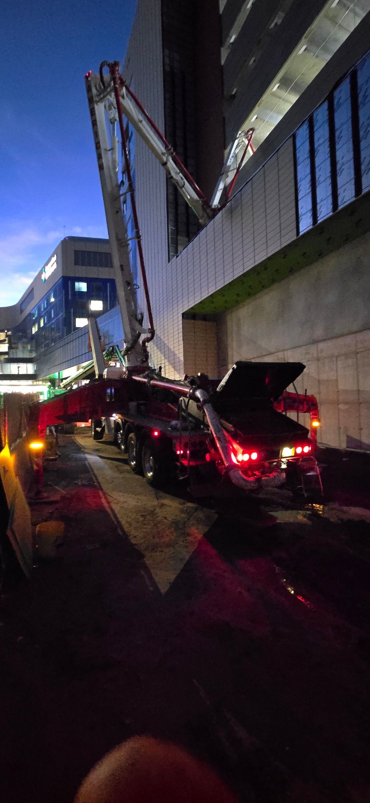 A Concrete Mixer Truck Is Parked in Front of A Building - Middletown, CT - American Concrete Pumping