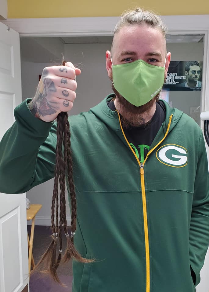 Man Holding Braided Hair — Washington, WI — North Shore Hair Design Inc