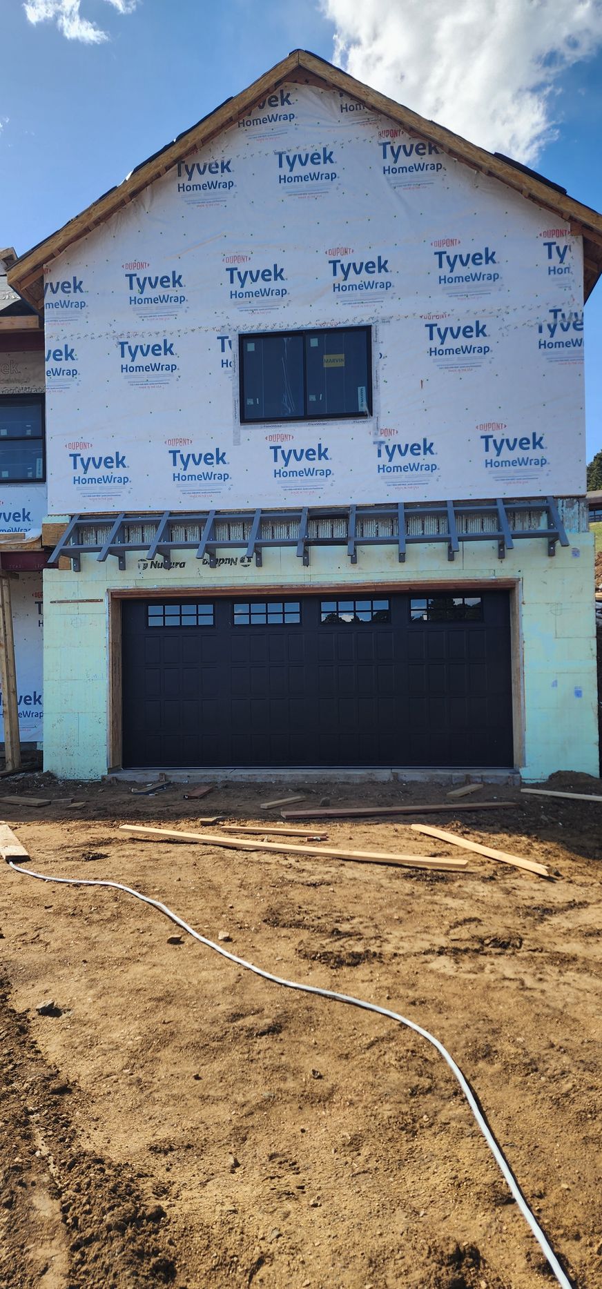 New Garage Door installation Black garage door with Decorative windows in Golden Colorado by Aeonic Garage Doors