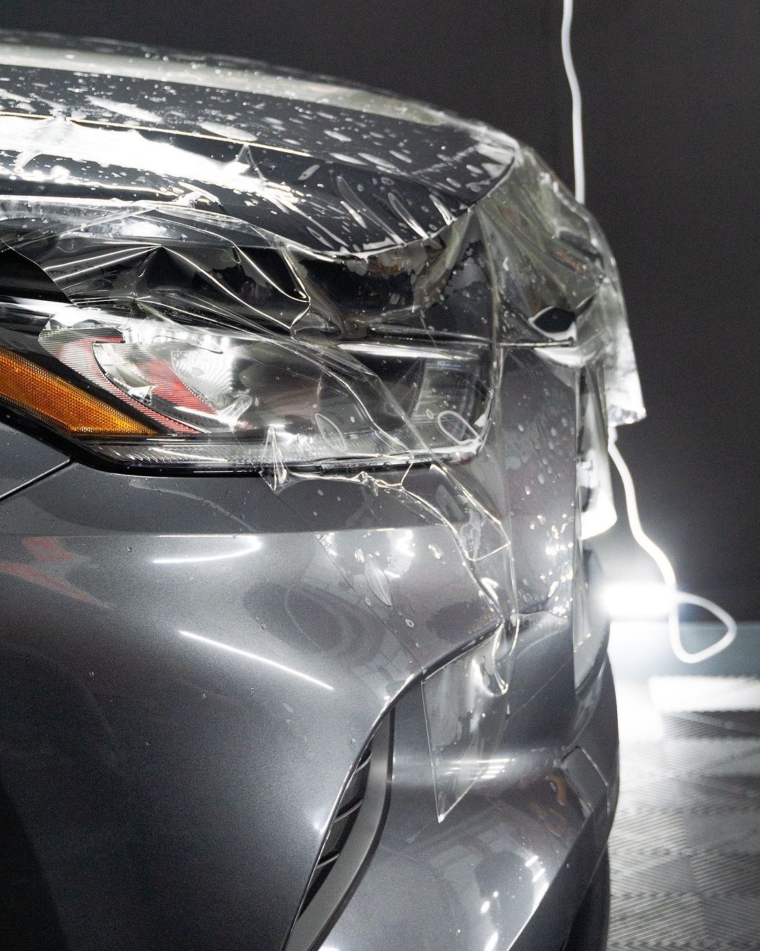 A close up of a car with the hood covered in paint protection film