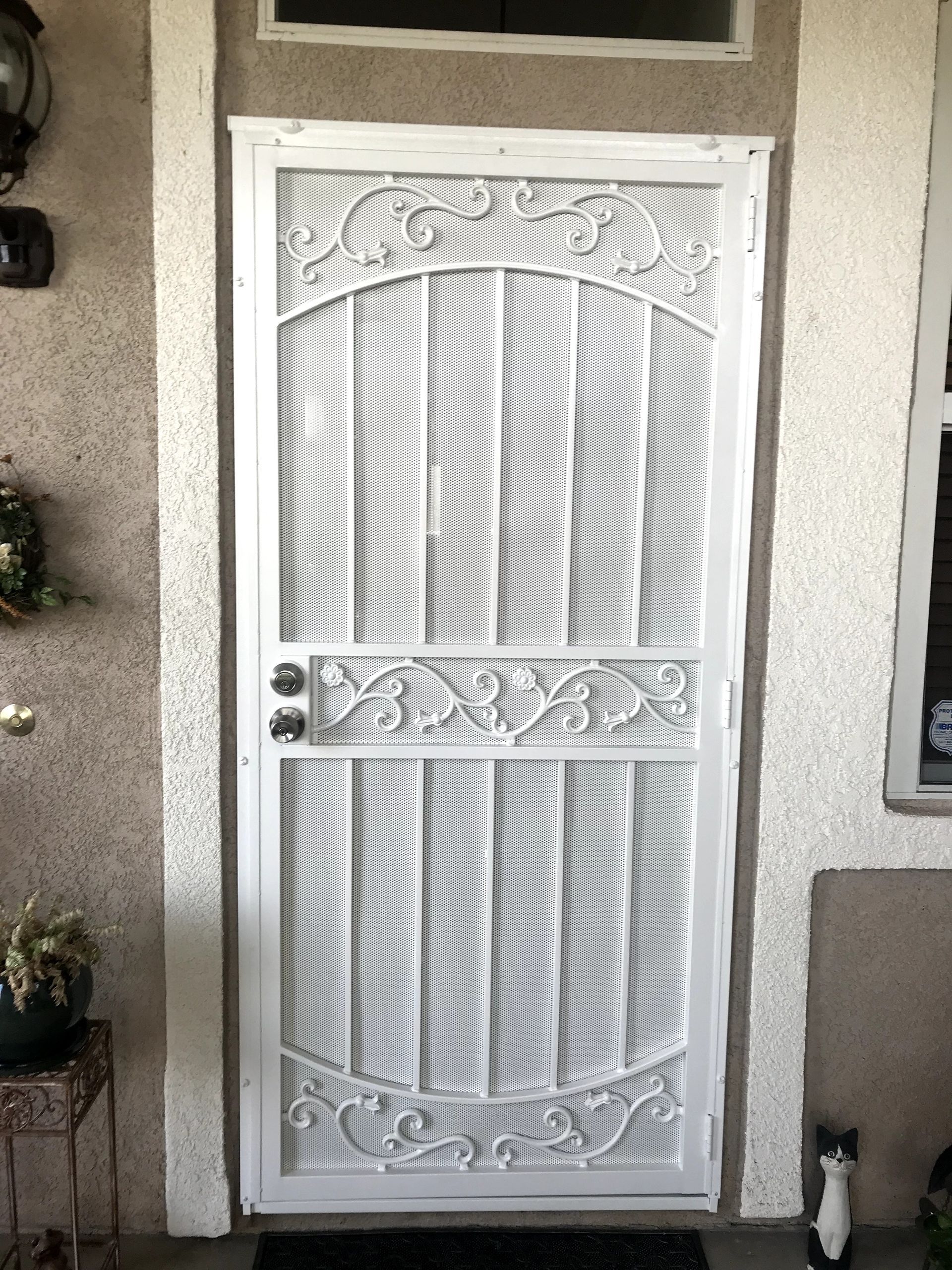 White steel security door installed by Mobile Screen Repair in Riverside, CA.