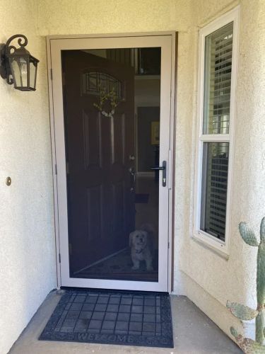 Front entry with newly installed swinging screen door. Mobile Screen Repair in Riverside, CA