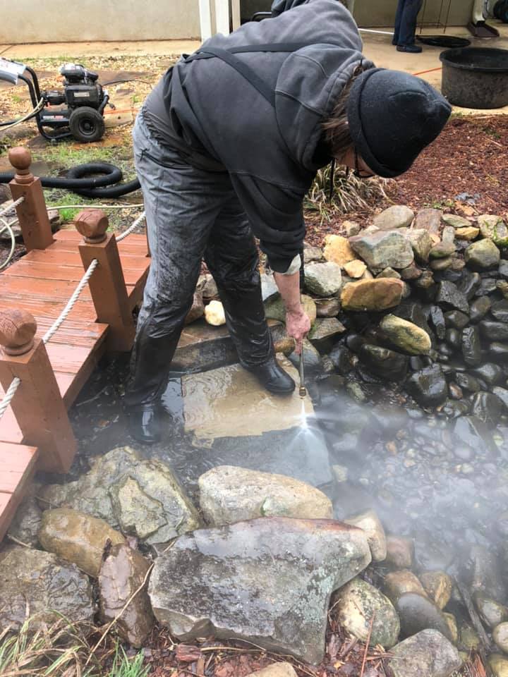 Staff Using Power Washer on Stone — Newnan, GA — Aqua Gardens