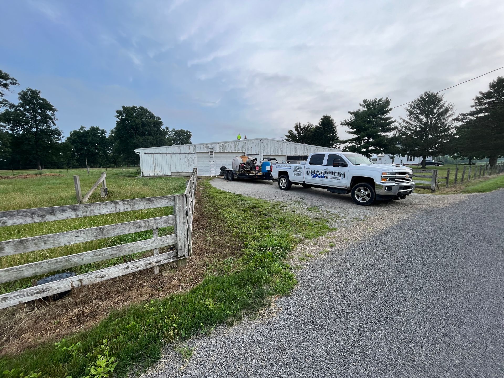 A room with a wooden door and a white ceiling.
