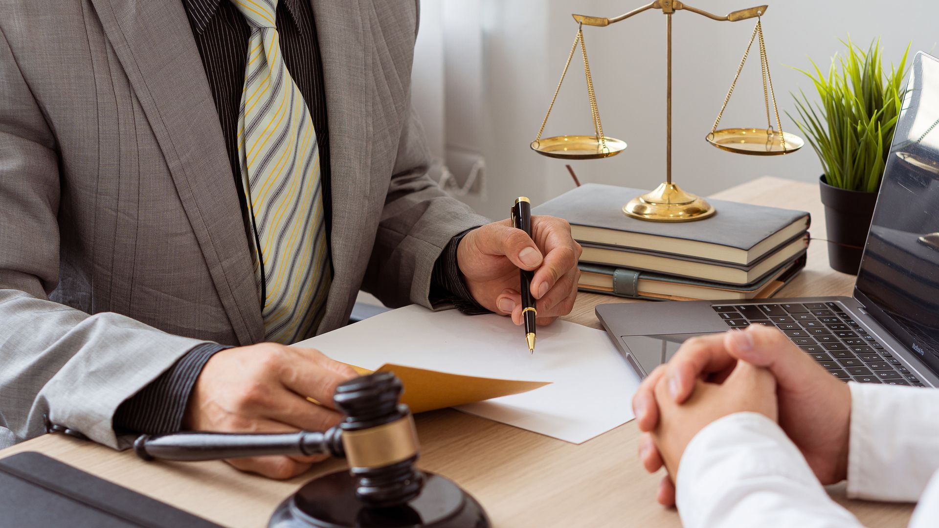 A lawyer is discussing a contract with his client.