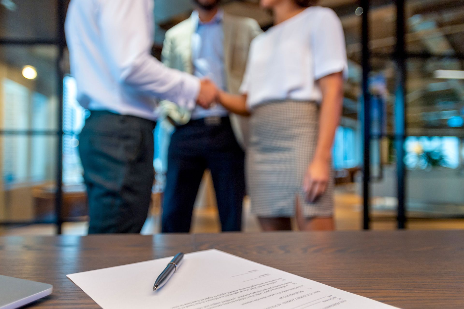 Shaking Hands With a Contract With a Third Man — Toowong, QLD — Australian Law Group