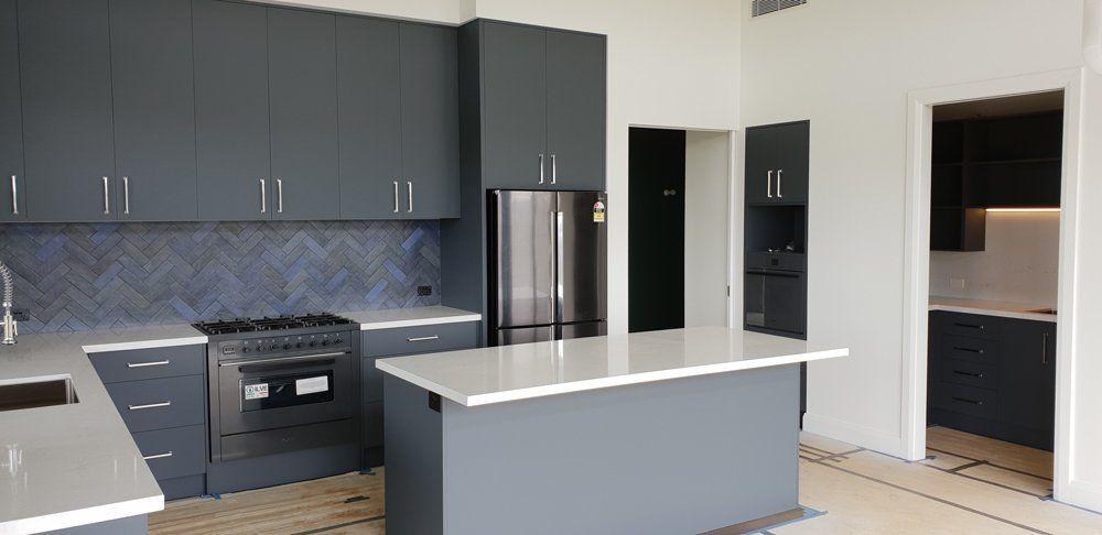Grey Kitchen Cabinetry &  Splashback — Bespoke Kitchens in Balaclava NSW