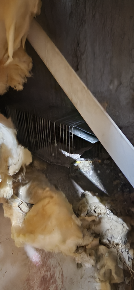 Woman in straw hat smiles, holding wine glass near a lake.